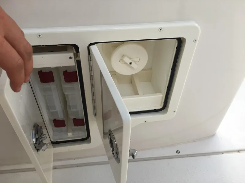 Slide: The Image of 2026 Sea Chaser 35 HFC boat compartment with open storage doors. - 22