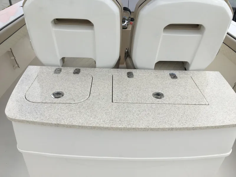 Slide: The Image of 2026 Sea Chaser 35 HFC boat interior with dual seats and storage compartments. - 23