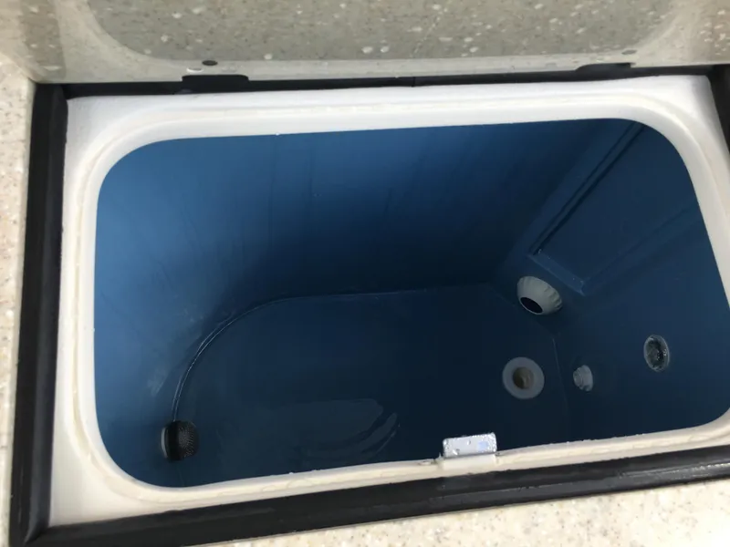 Slide: The Image of Livewell compartment of 2026 Sea Chaser 35 HFC boat, open and empty. - 24