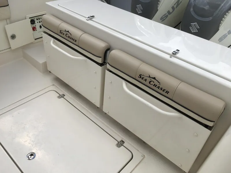 Slide: The Image of 2026 Sea Chaser 35 HFC boat seating area with storage compartments. - 28
