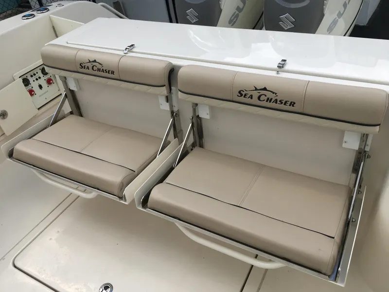Slide: The Image of 2026 Sea Chaser 35 HFC boat seats with beige upholstery and logo. - 29