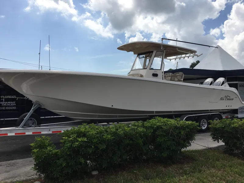 Slide: The Image of 2026 Sea Chaser 35 HFC boat on trailer under cloudy sky. - 3