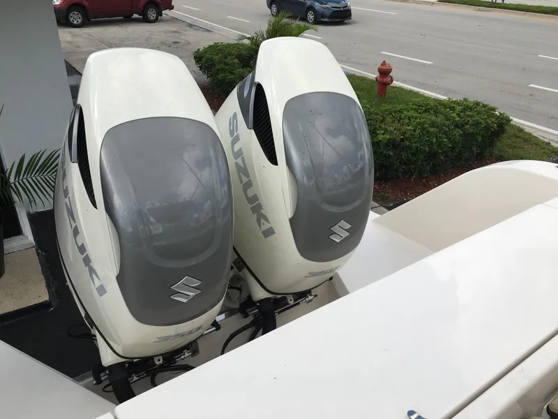 Slide: The Image of Twin Suzuki outboard motors on a 2026 Sea Chaser 35 HFC boat. - 31