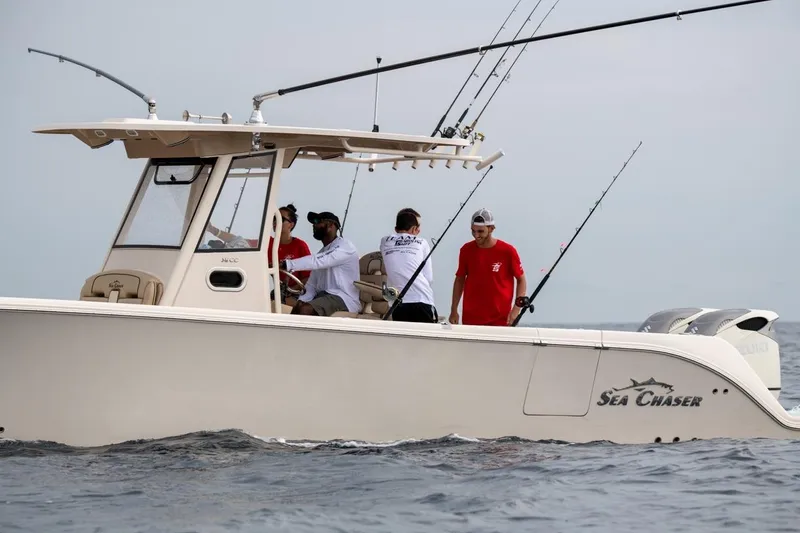 Slide: The Image of 2026 Sea Chaser 35 HFC boat with people fishing on open water. - 35
