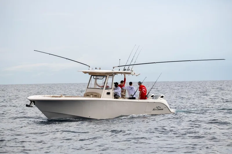 Slide: The Image of 2026 Sea Chaser 35 HFC boat with anglers fishing in open sea. - 38