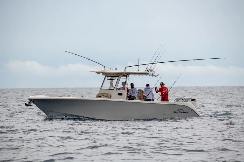 Slide: The Image of 2026 Sea Chaser 35 HFC boat with anglers fishing in open sea. - 39