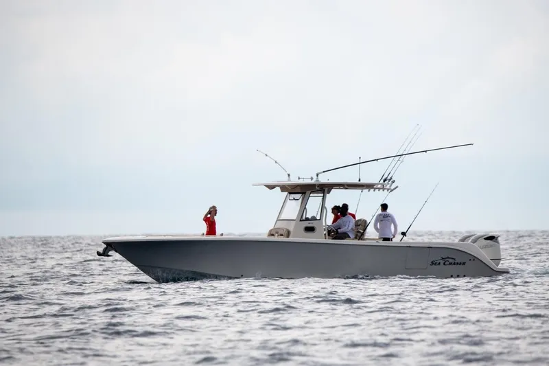 Slide: The Image of 2026 Sea Chaser 35 HFC boat with people fishing on open water. - 40