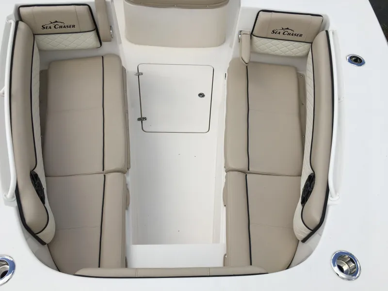 Slide: The Image of 2026 Sea Chaser 35 HFC boat interior with beige seating and storage compartment. - 6