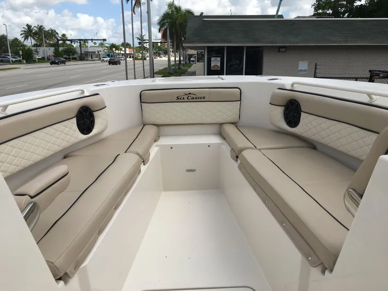 Slide: The Image of 2026 Sea Chaser 35 HFC boat interior with beige seating and speakers. - 7
