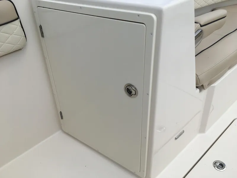 Slide: The Image of 2026 Sea Chaser 35 HFC boat storage compartment with cushioned seating. - 8