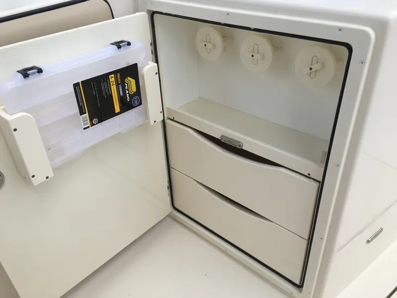 Slide: The Image of 2026 Sea Chaser 35 HFC storage compartment with drawers and tackle box holder. - 9