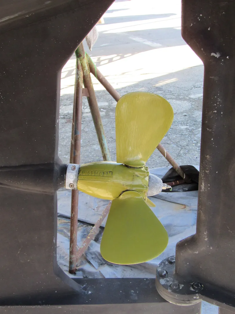 Slide: The Image of Propeller of 2009 Custom Pilothouse Cutter, displayed in dry dock setting. - 14