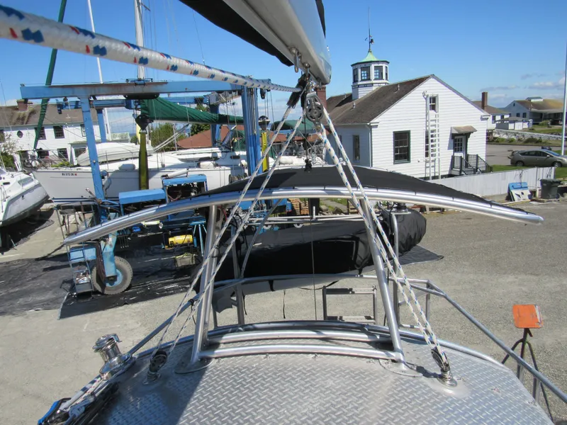 Slide: The Image of 2009 Custom Pilothouse Cutter on dry dock, with marina buildings in the background. - 38