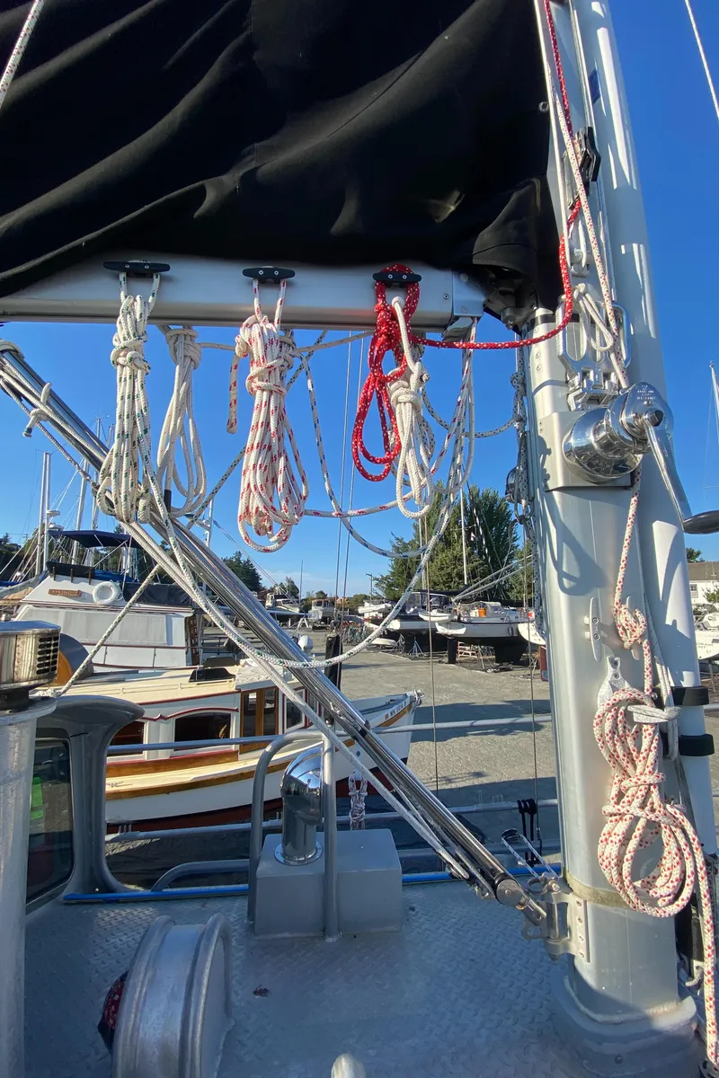 Slide: The Image of 2009 Custom Pilothouse Cutter sailboat rigging with ropes and mast details. - 46