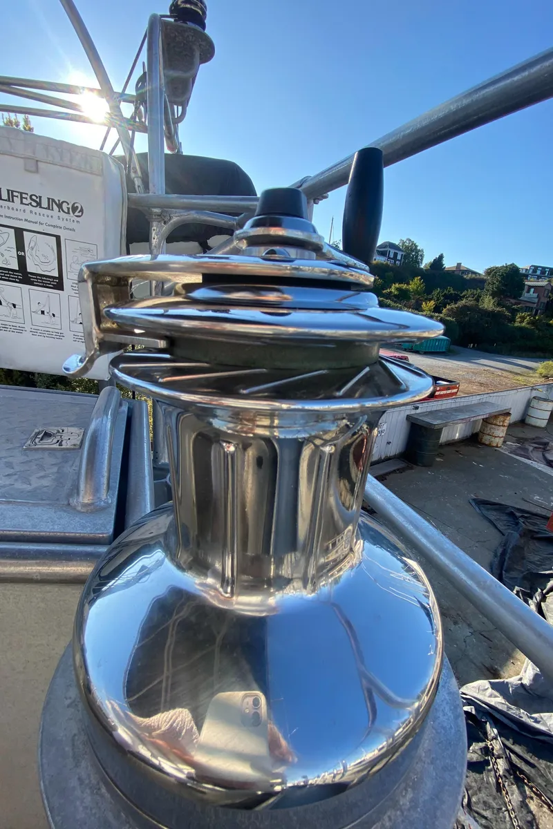 Slide: The Image of Shiny winch on 2009 Custom Pilothouse Cutter sailboat, reflecting sunlight. - 47