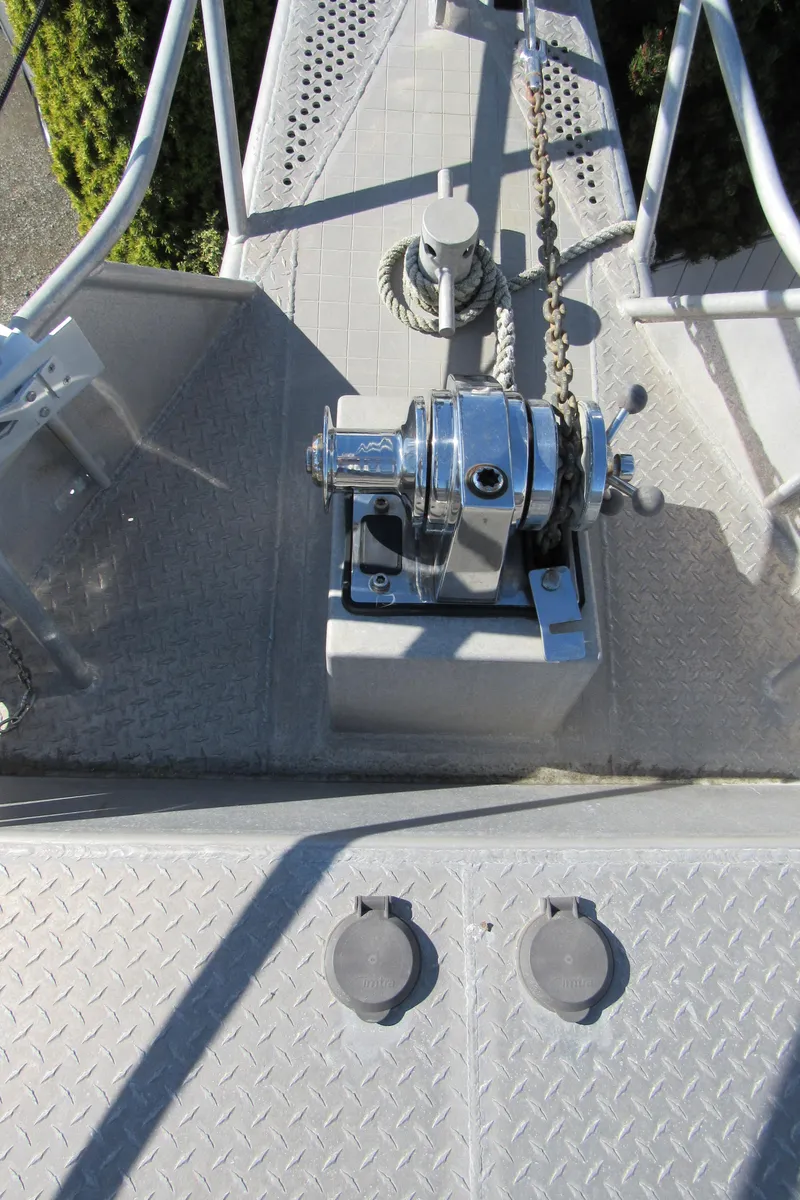 Slide: The Image of 2009 Custom Pilothouse Cutter deck with anchor winch and chain. - 7