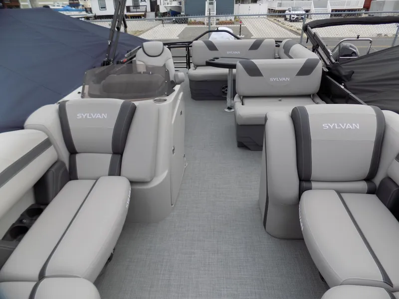 Slide: The Image of 2023 Sylvan L3 CLZ pontoon boat interior with gray seating and modern design. - 3