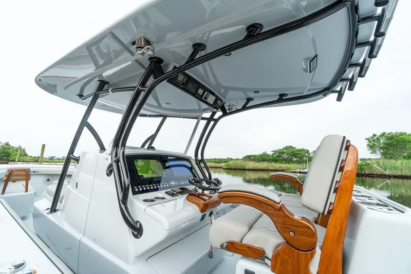Slide: The Image of 2025 Valhalla Boatworks V-33 center console with advanced navigation system and comfortable seating. - 6
