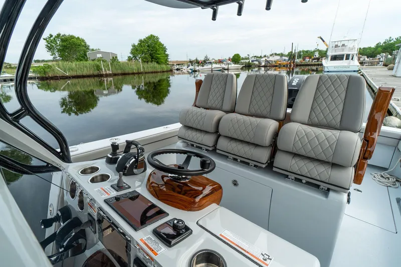 Slide: The Image of 2025 Valhalla Boatworks V-33 helm station with luxurious seating and advanced controls. - 7