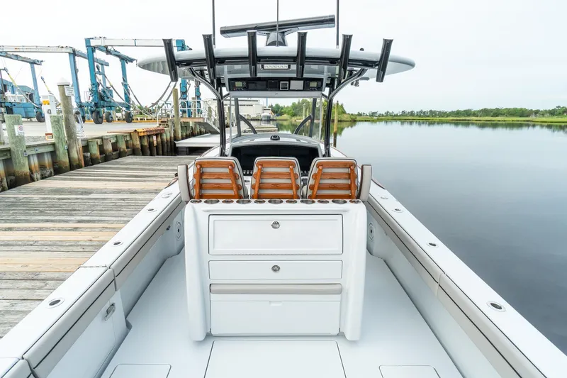 Slide: The Image of 2025 Valhalla Boatworks V-33 at dock, showcasing seating and storage. - 9
