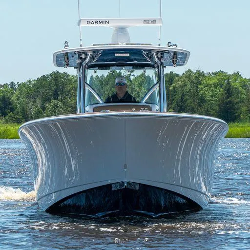 Slide: The Image of 2025 Valhalla Boatworks V-37 cruising on a river, front view. - 2
