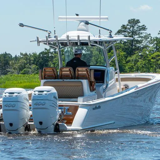 Slide: The Image of 2025 Valhalla Boatworks V-37 with twin 400 engines cruising on a river. - 3