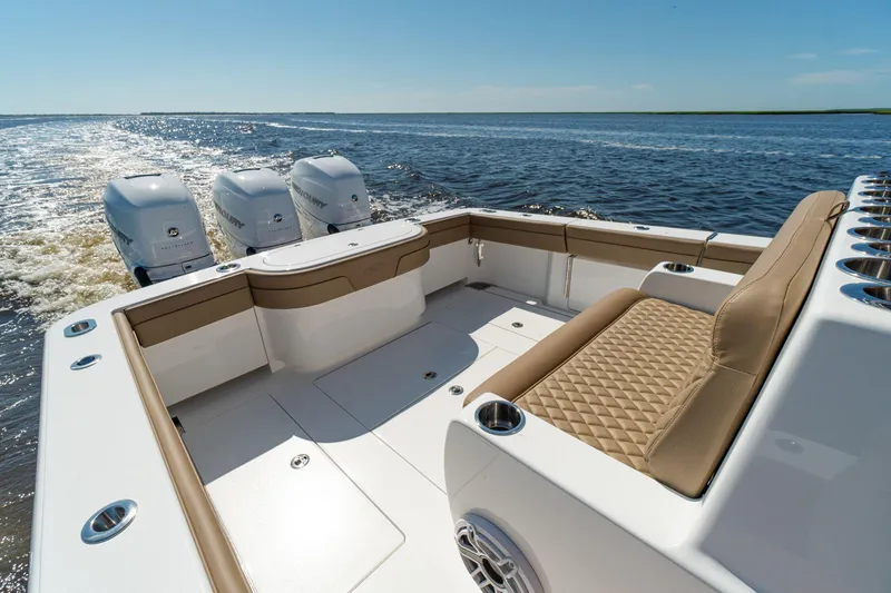 Slide: The Image of 2025 Valhalla Boatworks V-37, luxury seating, triple outboard engines, cruising on open water. - 8