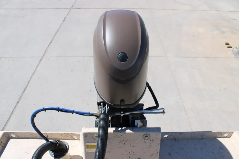 Slide: The Image of Outboard motor on Freedom 14 CHIQUITA boat, 2026 model, mounted on a concrete surface. - 14