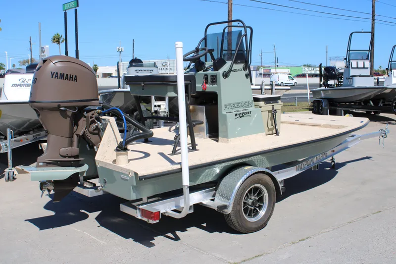 Slide: The Image of 2026 Freedom 14 CHIQUITA boat with Yamaha motor on trailer at dealership. - 5