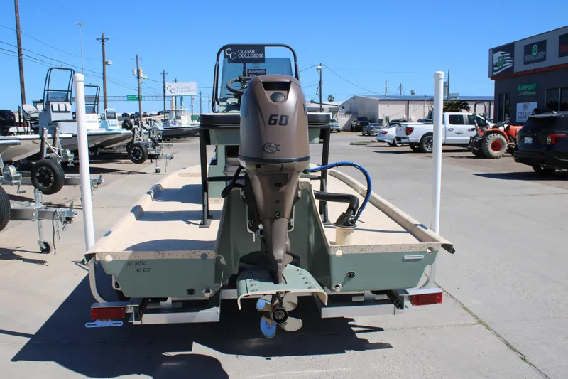 Slide: The Image of Boat dealership showcasing a 2026 Freedom 14 CHIQUITA with a 60 HP outboard motor. - 6