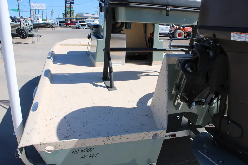 Slide: The Image of 2026 Freedom 14 CHIQUITA boat with durable, rot-resistant deck in a dealership lot. - 9