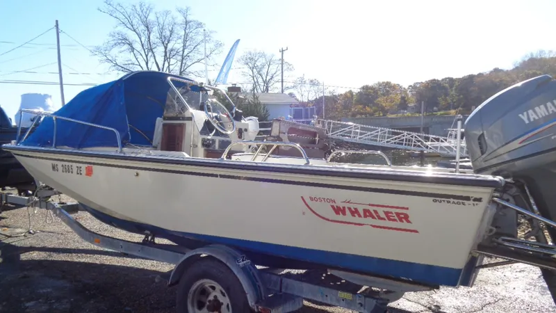 Slide: The Image of 1987 Boston Whaler 18 Outrage boat on trailer with Yamaha outboard motor. - 0