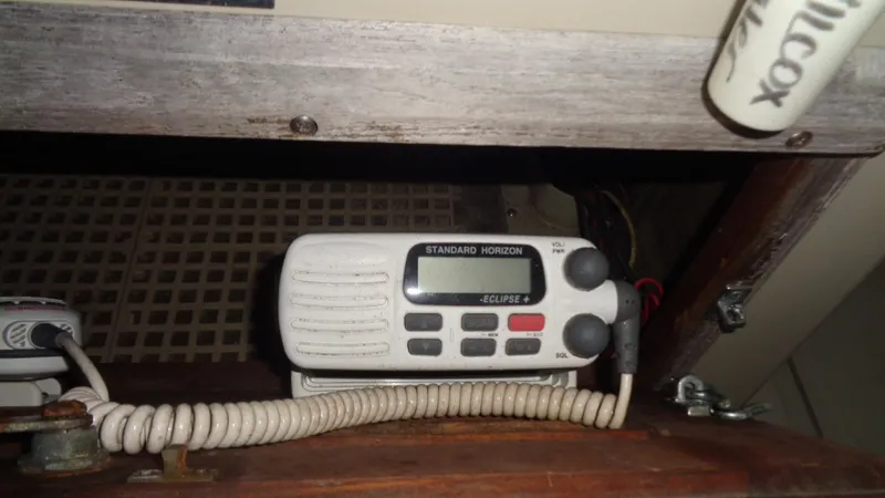 Slide: The Image of VHF radio on 1987 Boston Whaler 18 Outrage boat, featuring Standard Horizon Eclipse model. - 17