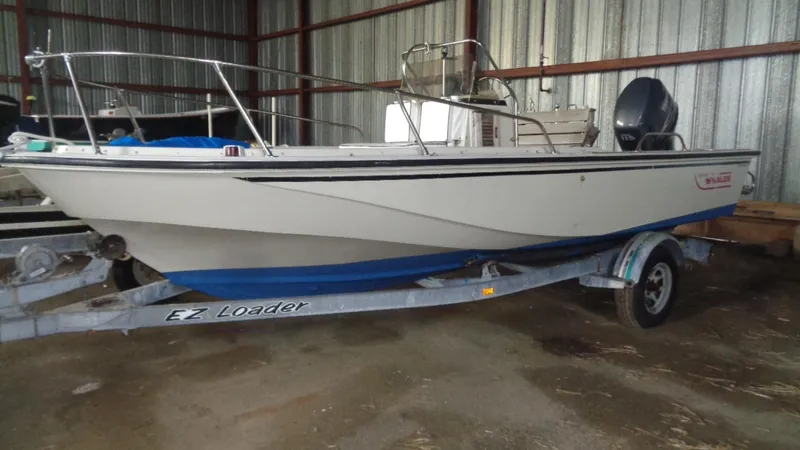 Slide: The Image of 1987 Boston Whaler 18 Outrage boat on EZ Loader trailer in storage. - 5
