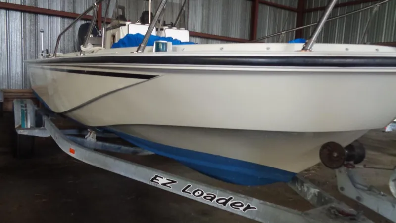 Slide: The Image of 1987 Boston Whaler 18 Outrage on EZ Loader trailer in storage facility. - 7