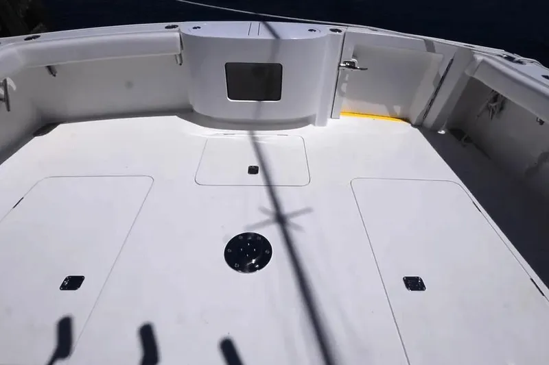 Slide: The Image of Henriques 50 EXHT 2026 boat deck, spacious and clean, with storage compartments. - 5