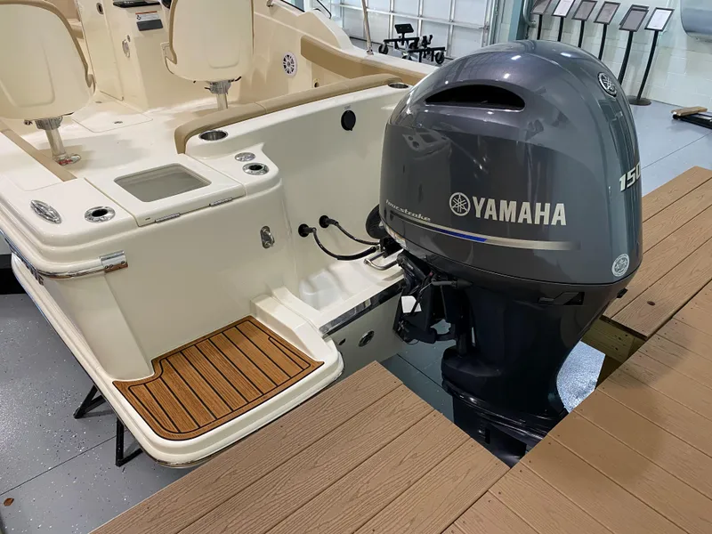 Slide: The Image of 2024 Scout 215 Dorado boat with Yamaha 150 outboard motor. - 2
