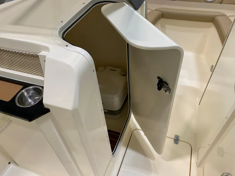 Slide: The Image of 2024 Scout 215 Dorado boat interior with open storage compartment. - 5