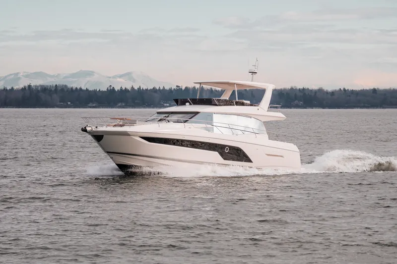 The Image of 2024 Prestige 590 yacht cruising on open water. - 0