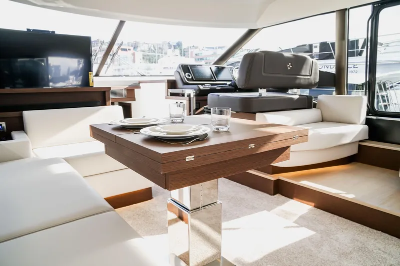 Slide: The Image of Luxurious interior of 2024 Prestige 590 yacht with elegant dining area. - 14