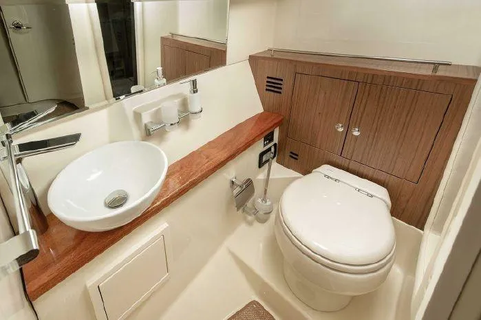 Slide: The Image of Luxurious bathroom in 2024 Chris-Craft Launch 35 GT boat with modern fixtures. - 12