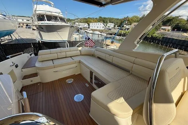 Slide: The Image of 2025 Chris-Craft Launch 35 GT boat interior with luxurious seating and wooden deck. - 13