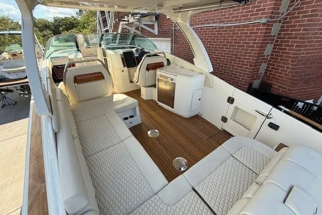 Slide: The Image of Luxurious interior of 2025 Chris-Craft Launch 35 GT boat with elegant seating and wood flooring. - 14