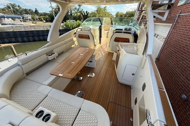 Slide: The Image of Luxurious 2025 Chris-Craft Launch 35 GT boat interior with elegant seating and wooden flooring. - 15