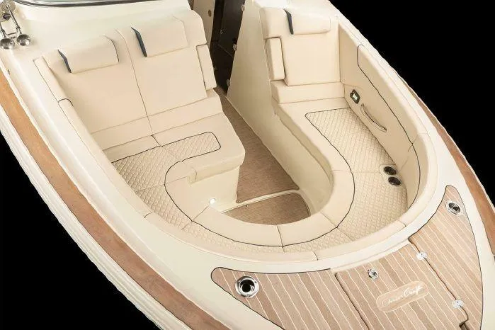 Slide: The Image of 2024 Chris-Craft Launch 35 GT boat interior with luxurious seating and teak flooring. - 5