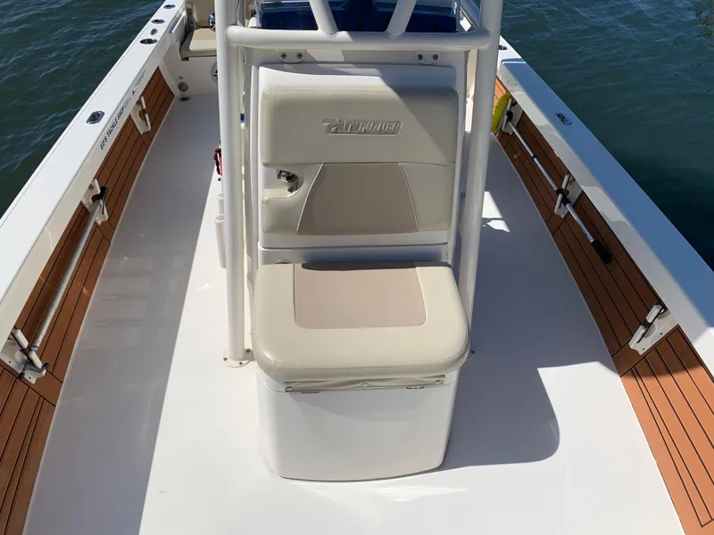 Slide: The Image of 2017 Pathfinder 2500 Hybrid boat interior with seating and storage on deck. - 31