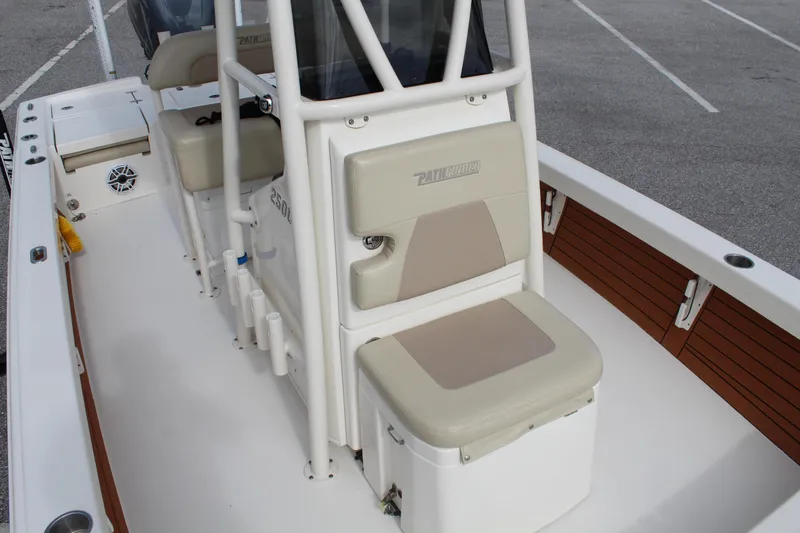 Slide: The Image of 2017 Pathfinder 2500 Hybrid boat interior with cushioned seating and storage. - 32