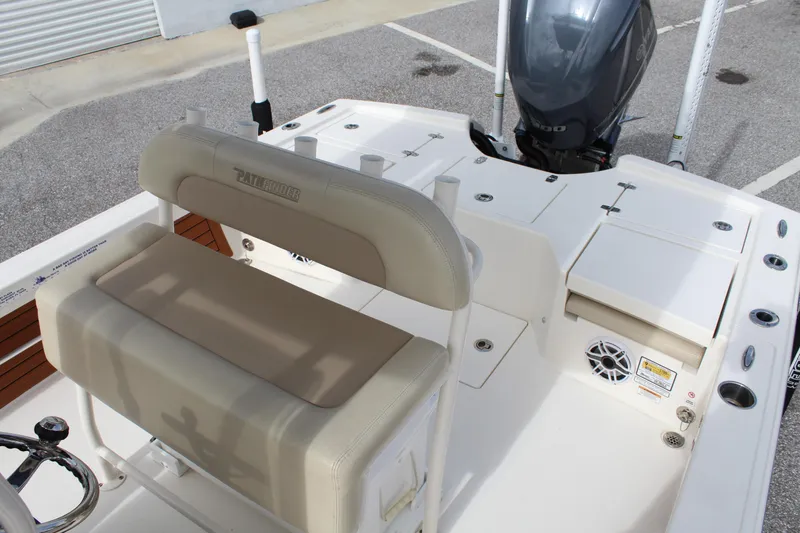 Slide: The Image of 2017 Pathfinder 2500 Hybrid boat interior with seating and motor. - 36