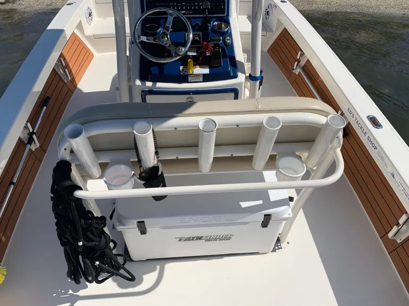 Slide: The Image of 2017 Pathfinder 2500 Hybrid boat interior with rod holders and steering console. - 40