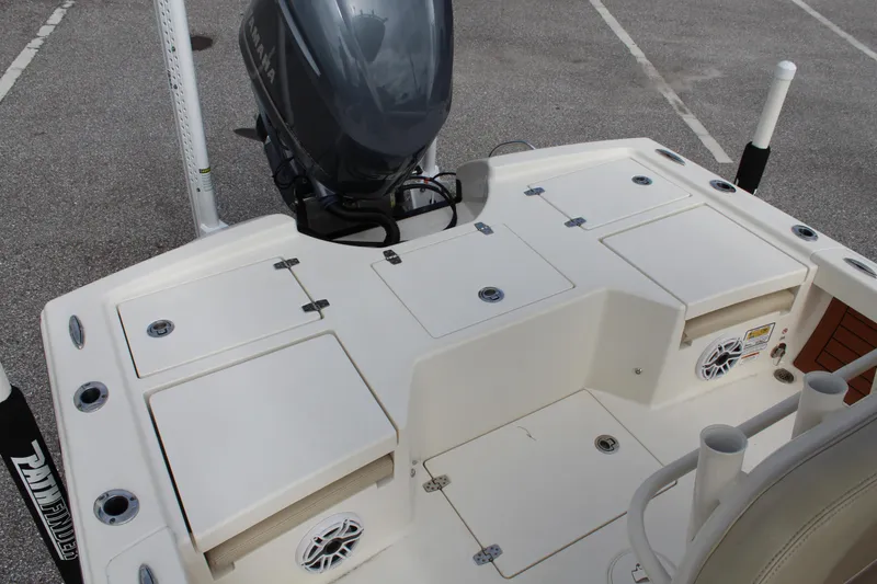 Slide: The Image of 2017 Pathfinder 2500 Hybrid boat deck with storage compartments and motor. - 47